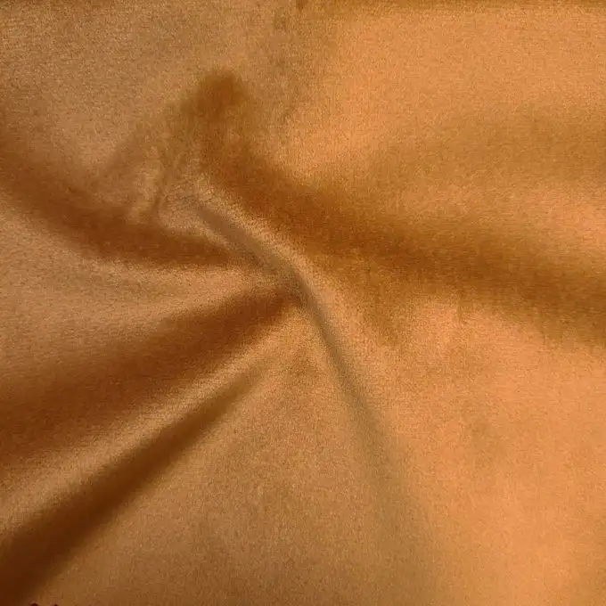 Velluto tocco pesca tinta unita zafferano